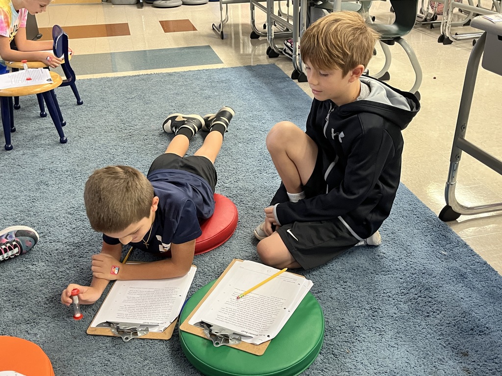 Students work in pairs and take turns reading an article aloud.