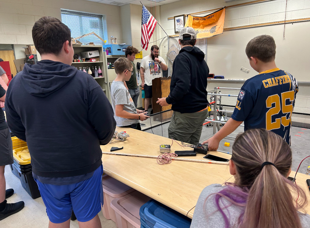 High school students talk about robotics.