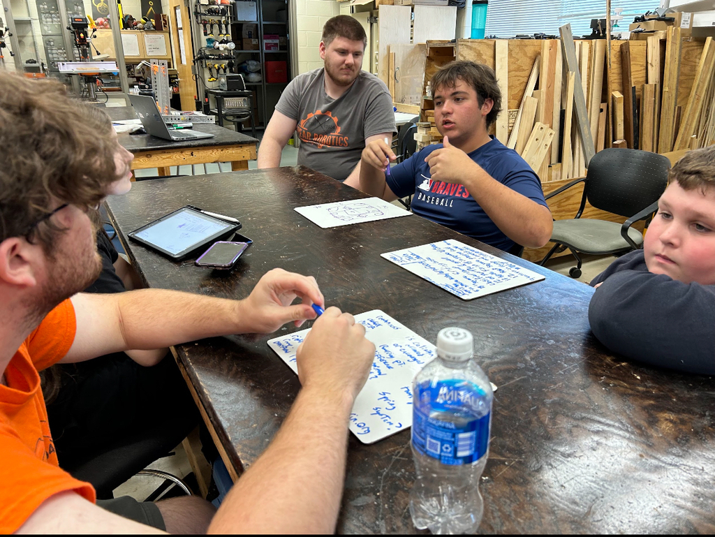 High school students talk about robotics.