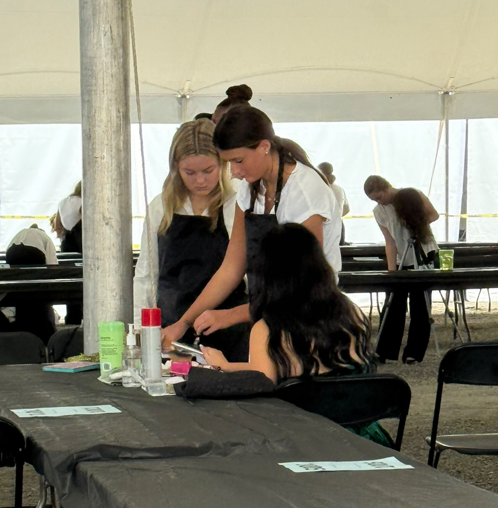 Students participate in a cosmetology competition at the state fair..