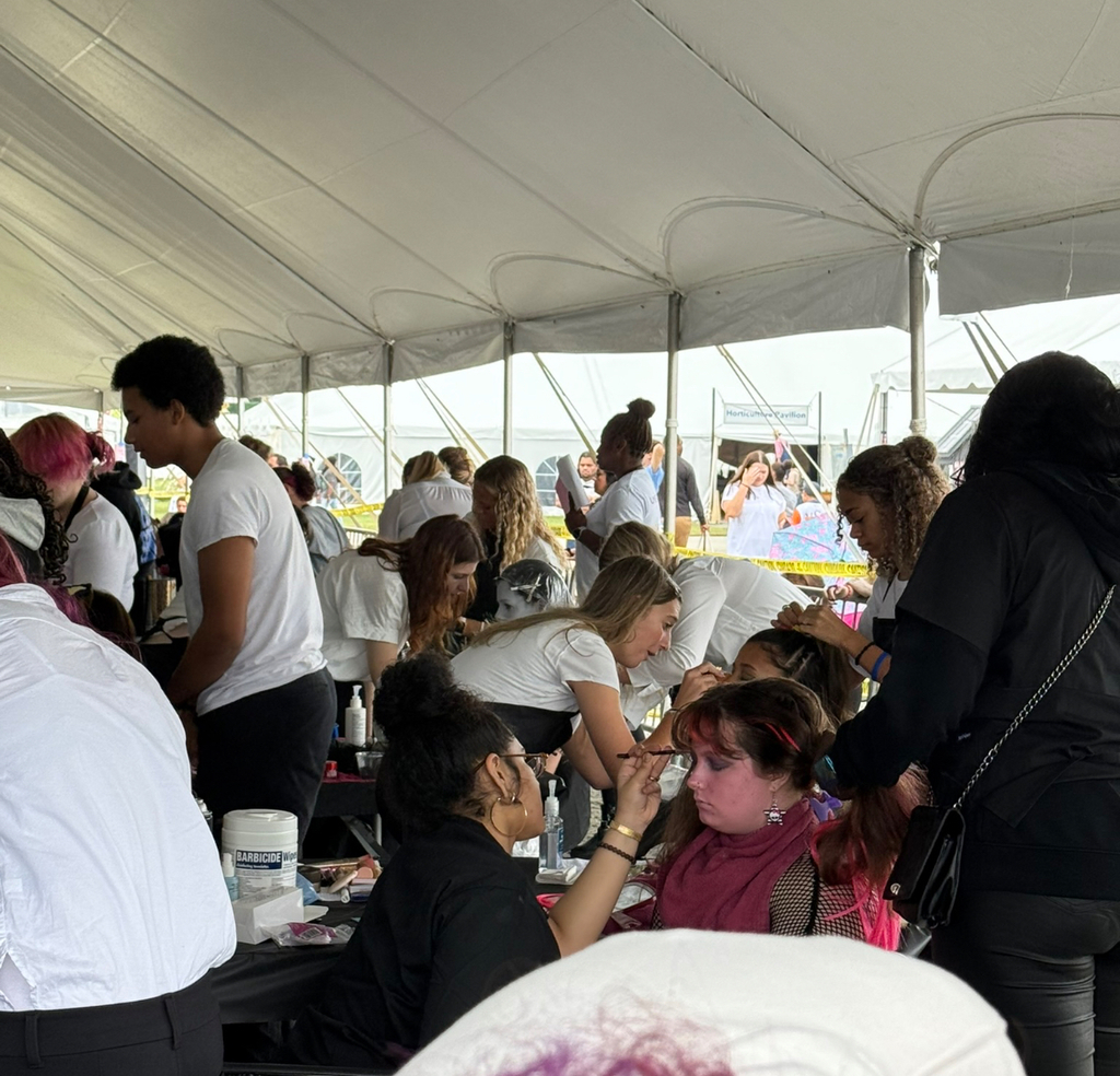 Students participate in a cosmetology competition at the state fair..