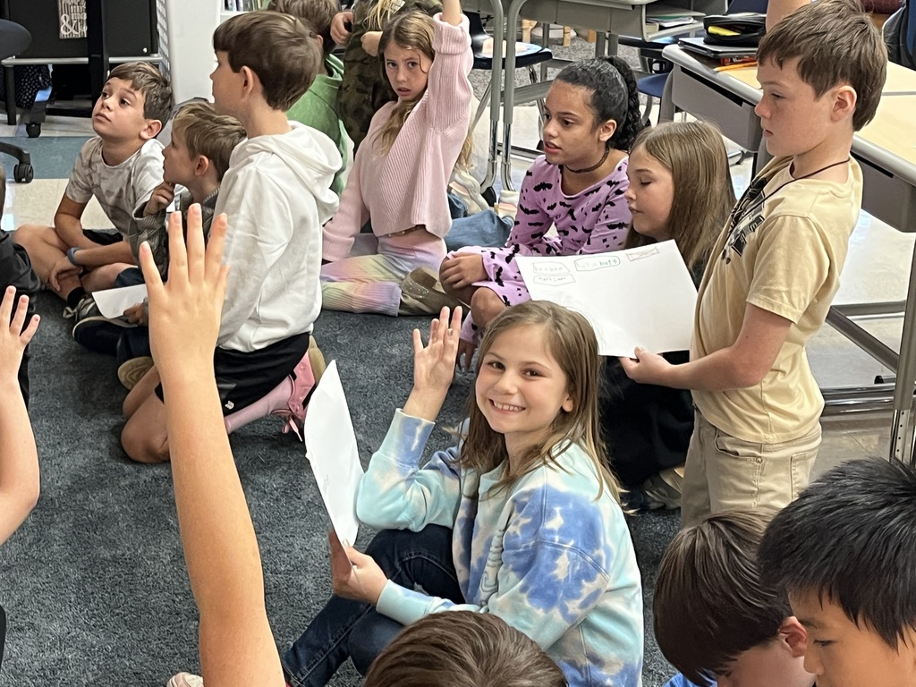 Students participate in a lesson. 