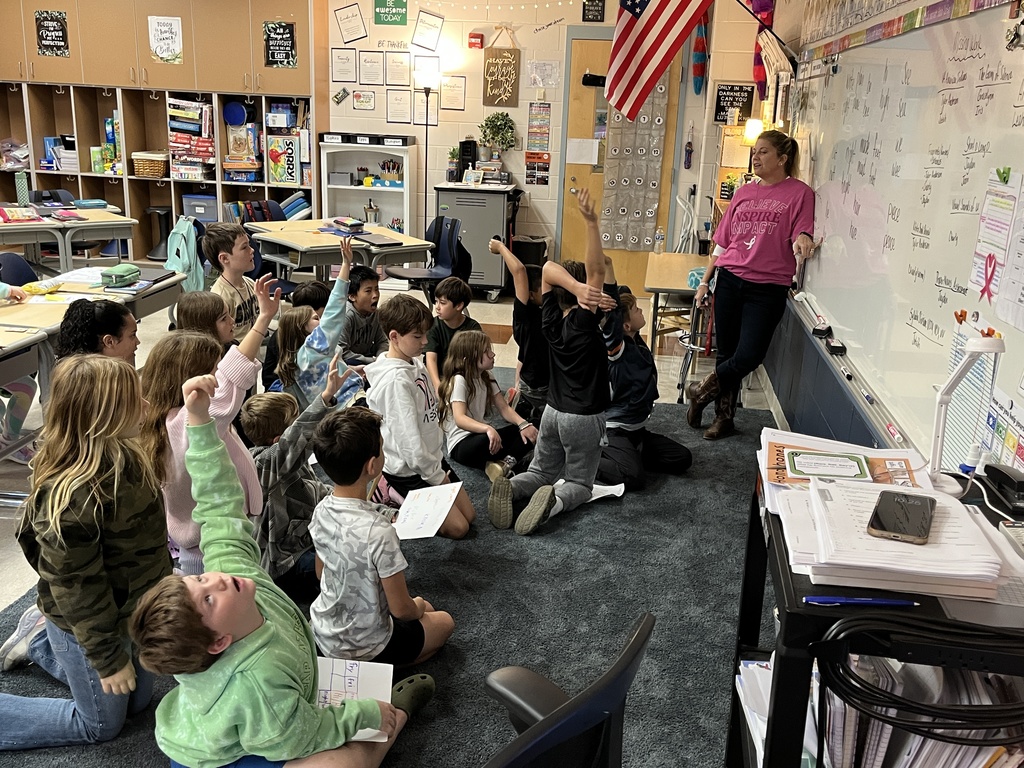 A teacher reviews homophones with a group of students.