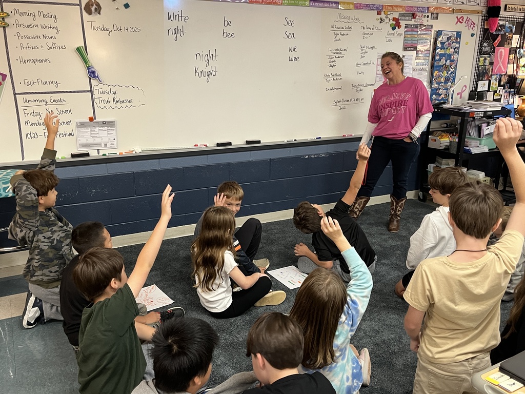 A teacher reviews homophones with a group of students.