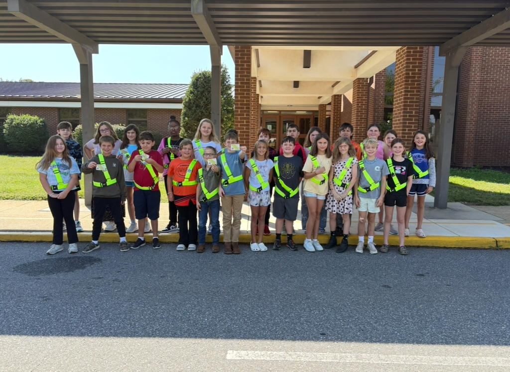 Student safety patrol members pose for a group photo.