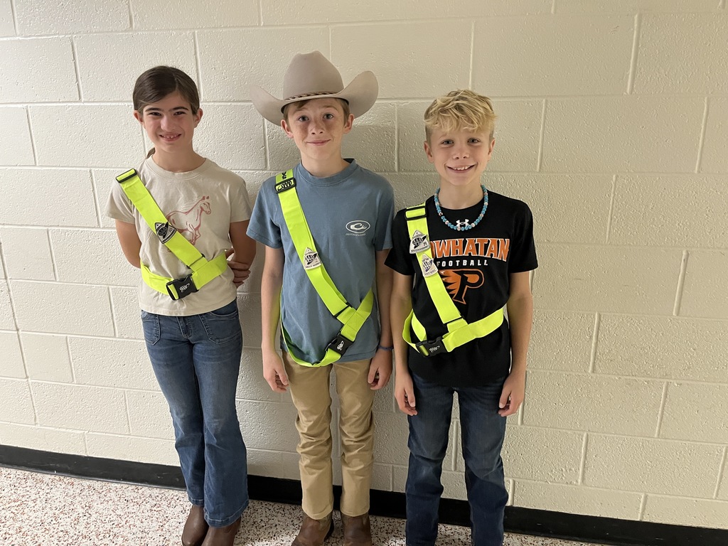 Student safety patrol members pose for a photo.