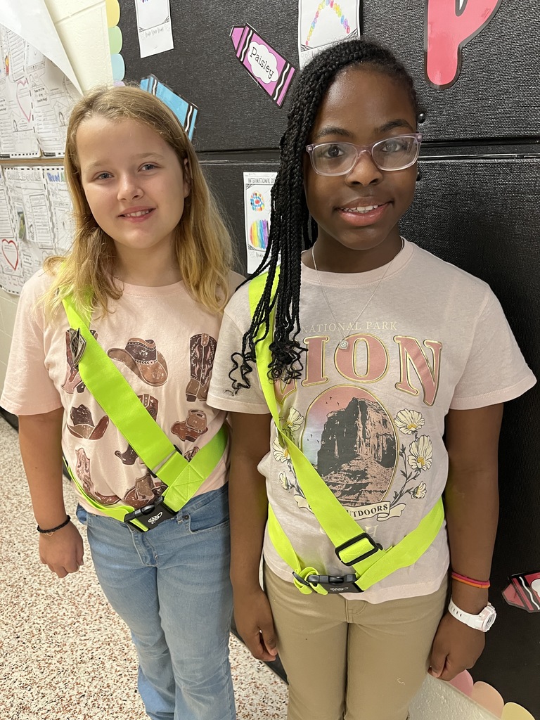 Student safety patrol members pose for a photo.