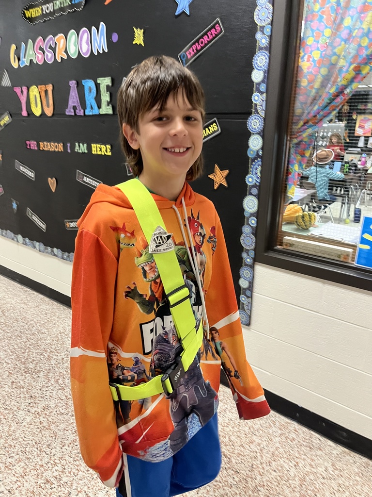 A student safety patrol member poses for a photo.