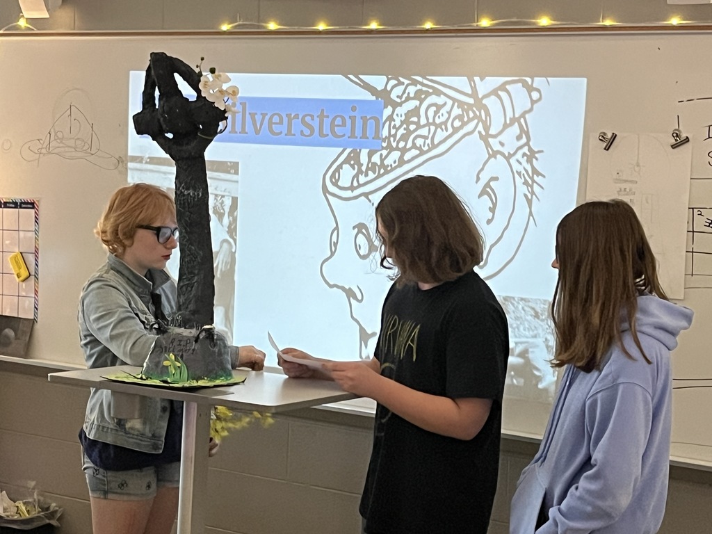 Students Present a poet tombstone project in art class. 