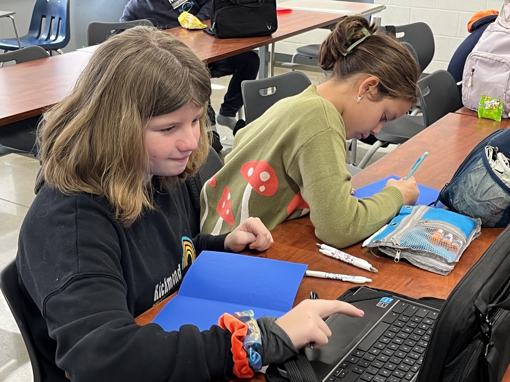 Students make Veterans Day cards for veterans.