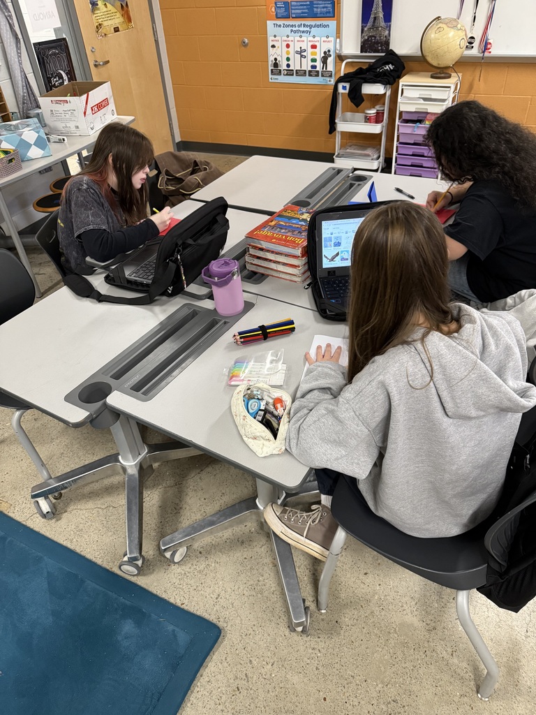 Students make Veterans Day cards for veterans.