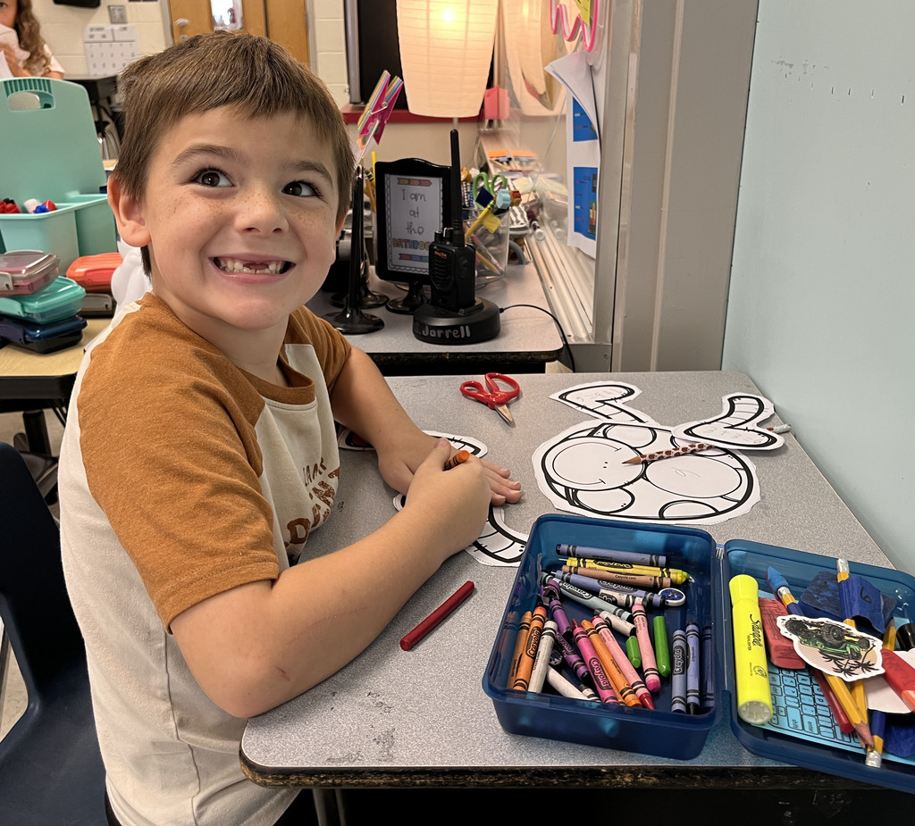 A child works on a math bug activity. 