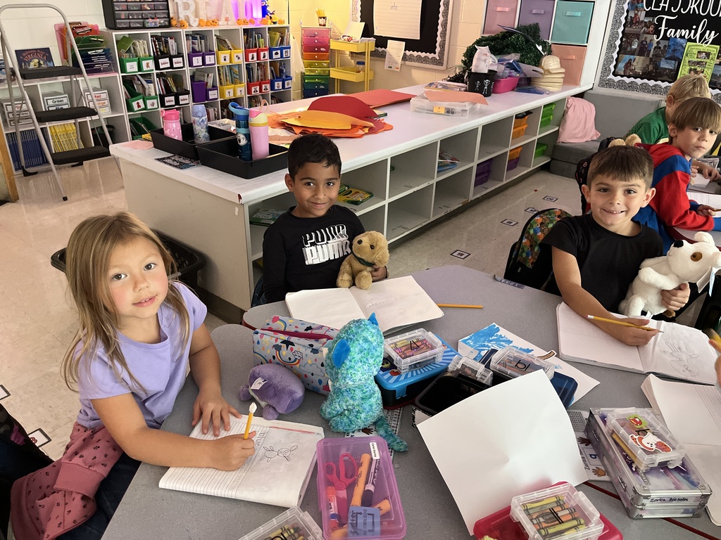 Students use  a stuffie they brought to school for a writing assignment. 