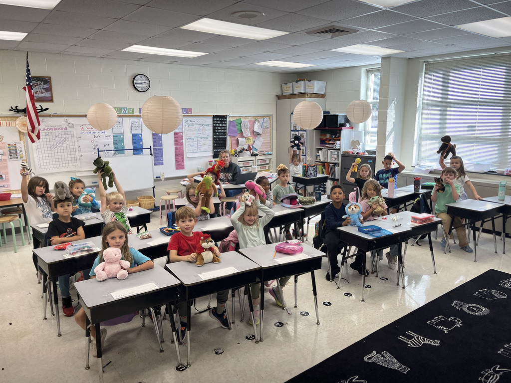 Students use  a stuffie they brought to school for a writing assignment. 