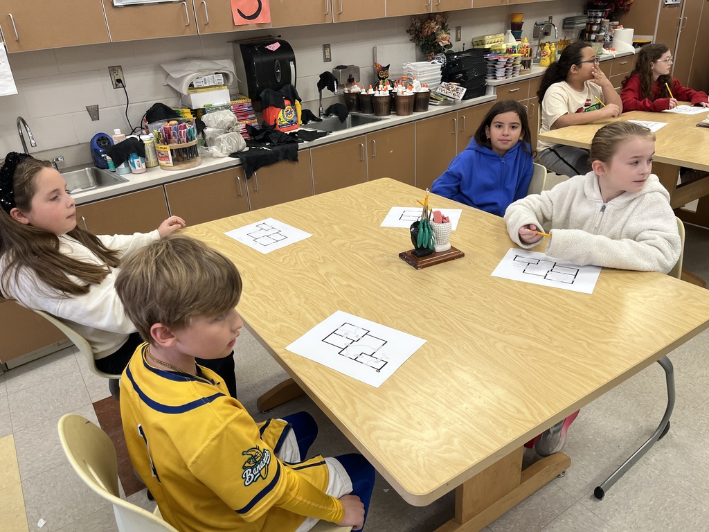 Students work on fire safety escape plans.