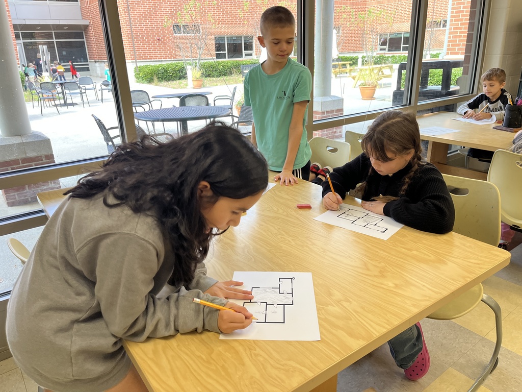 Students work on fire safety escape plans.