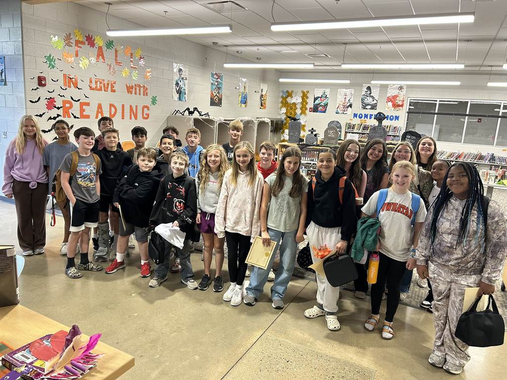 A group of students pose for a group photo.