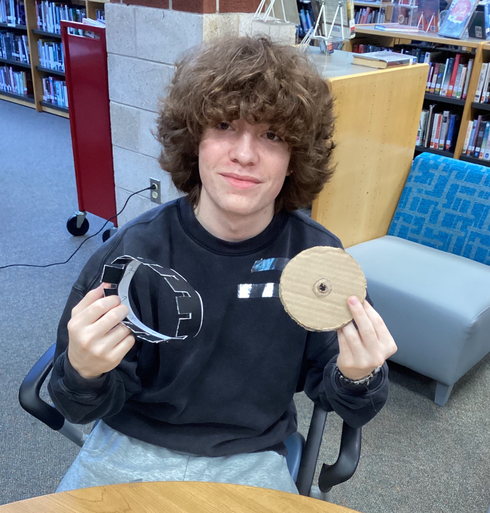 A student builds a zoetrope in an intro to film class.