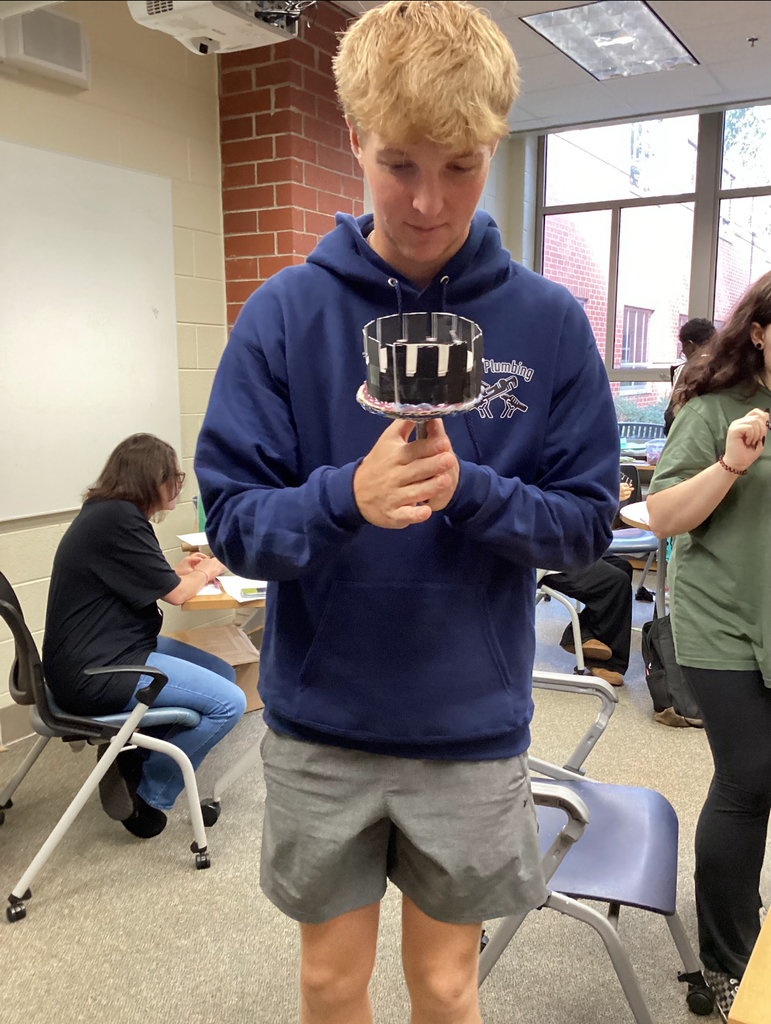 A student builds a zoetrope in an intro to film class.