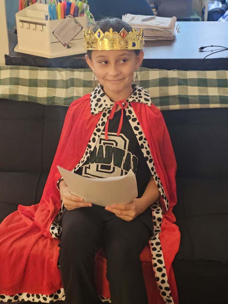 A student in costume performs in a Jamestown reader’s theater skit.