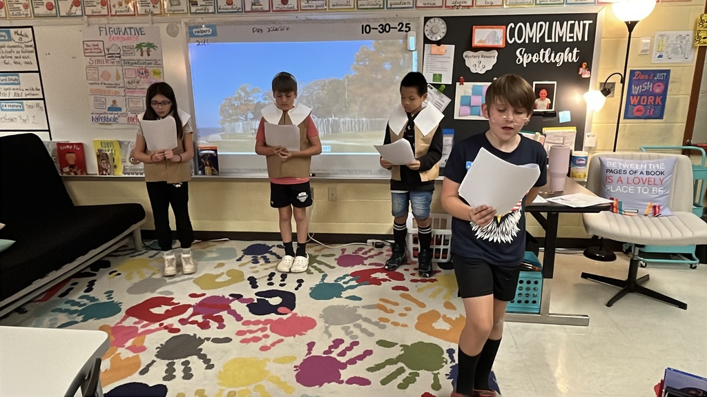 Students in costume perform in a Jamestown reader’s theater skit.