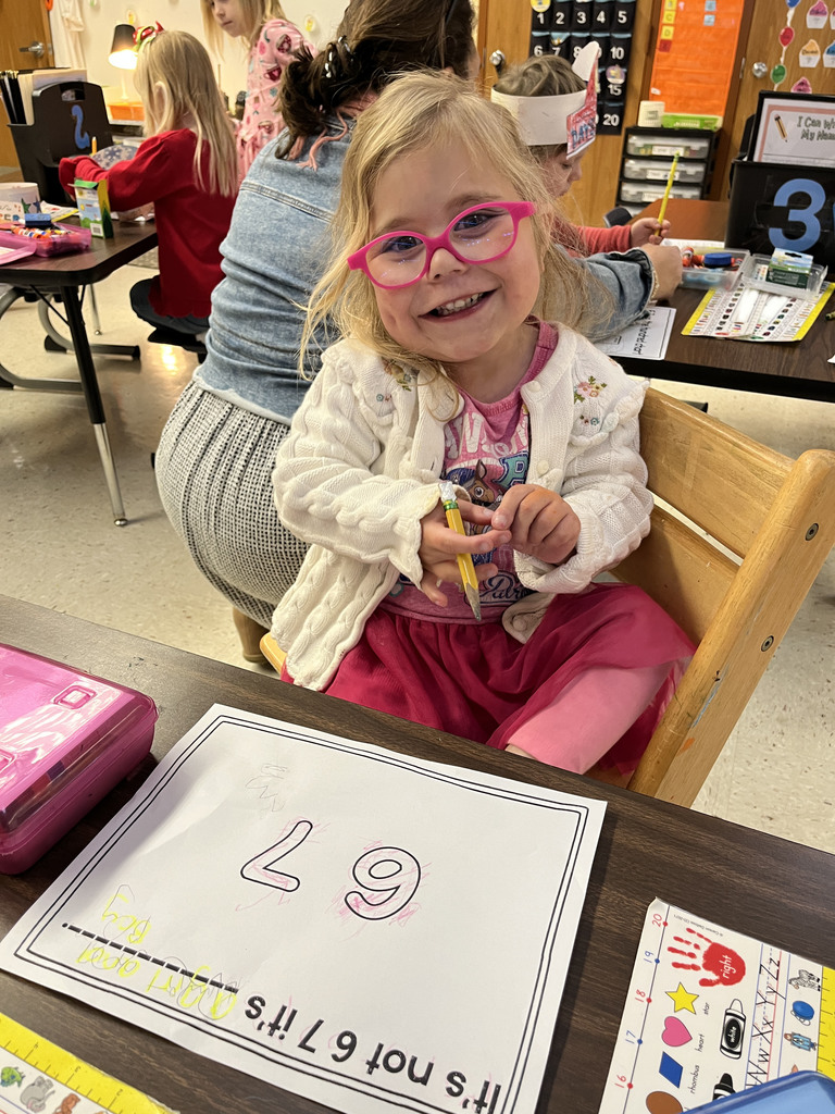 A student in class works on a 67th day of school activity. 