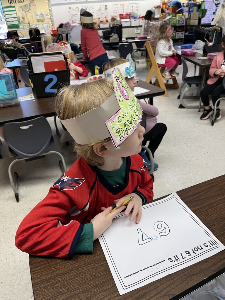 A student in class works on a 67th day of school activity. 