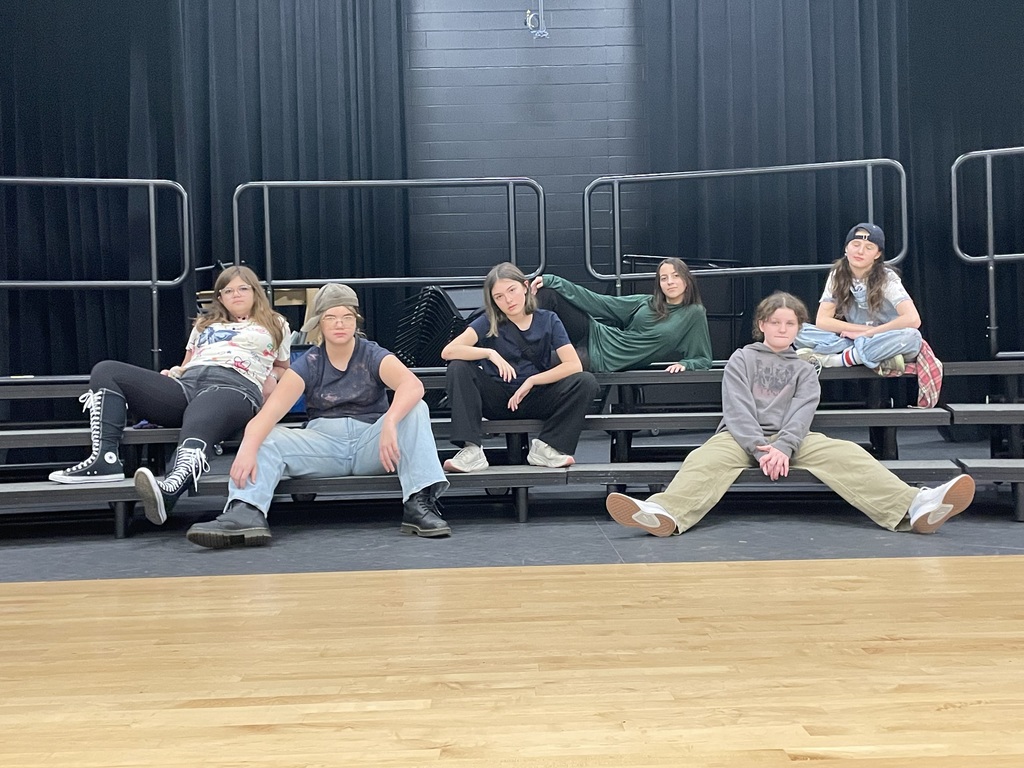 Group of middle school students posing on risers.