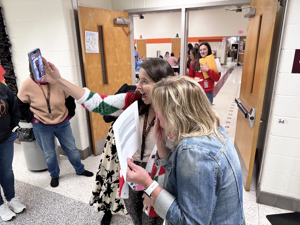 Two women video chat with a man. 