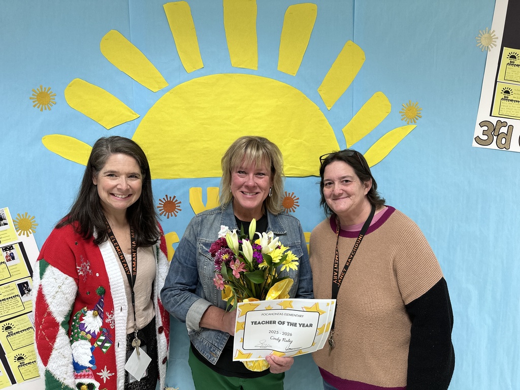 A group of women pose for a photo. One holds a certificate.