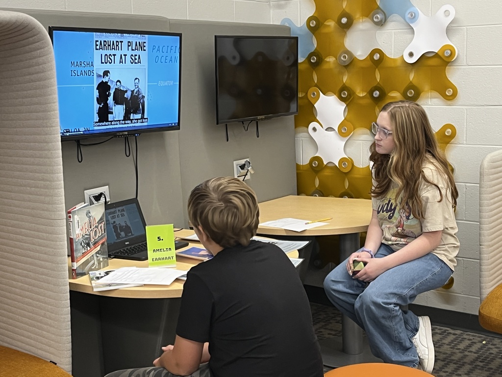 Students participate in a Mysteries, Myths, and Monsters research unit  in the library.