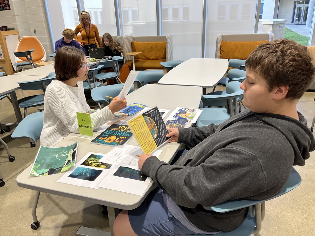 Students participate in a Mysteries, Myths, and Monsters research unit  in the library.