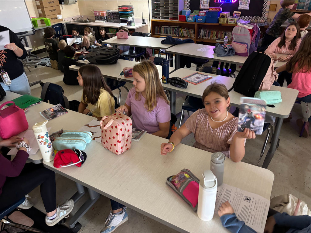  Students participate in an elementary school book club.