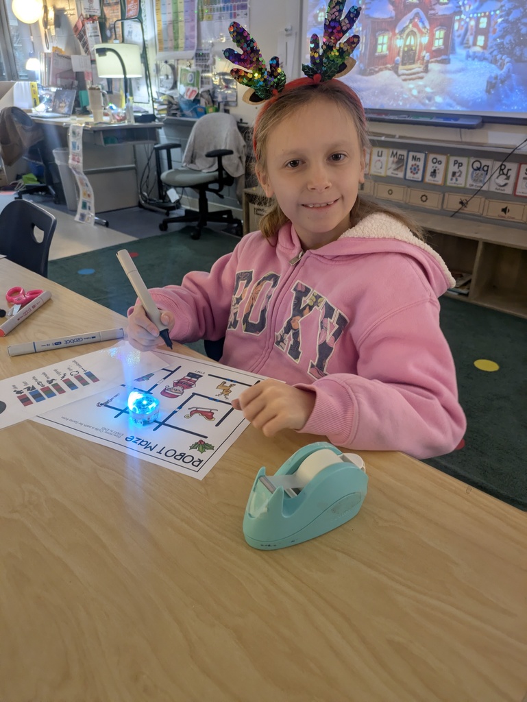 A student uses Ozobots in technology class.