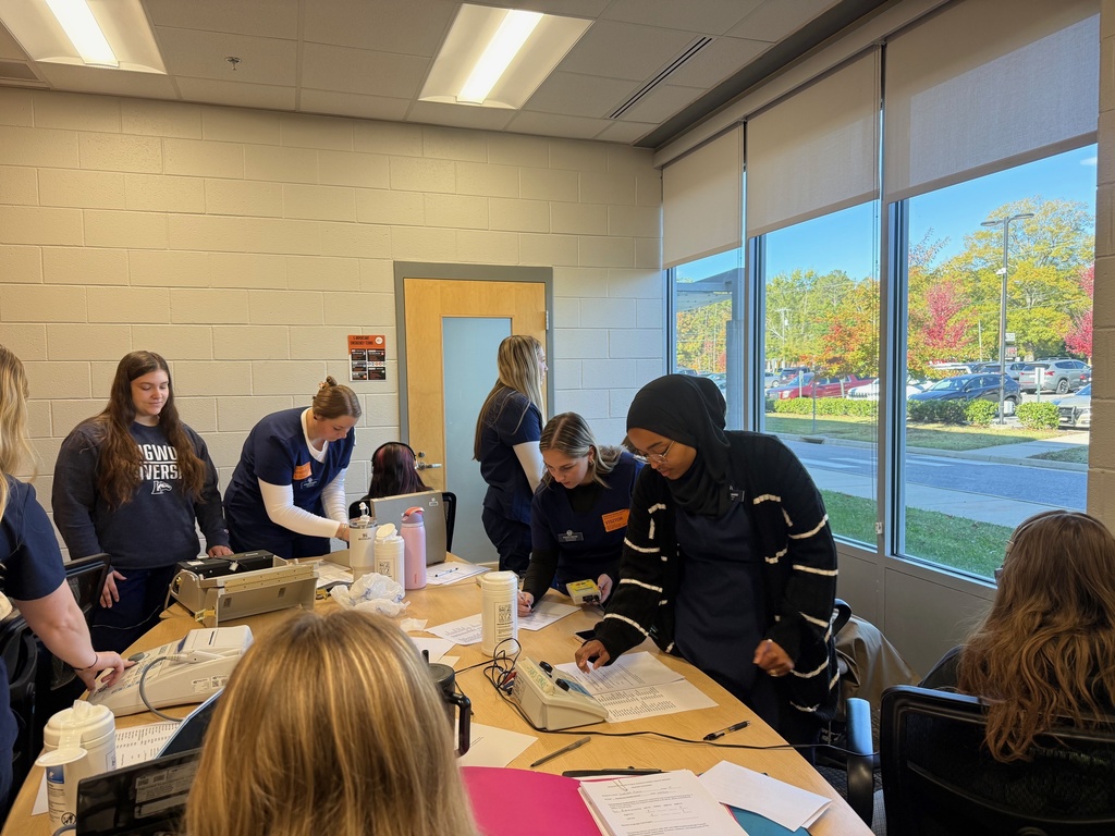 College students conduct hearing tests at a middle school.