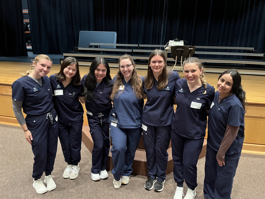 A group of speech-language pathology students pose for a photo.