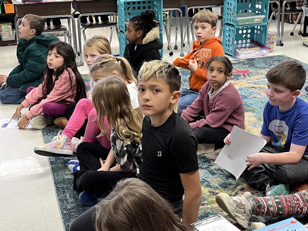 Students listen to a lesson on the different ways the letter Y can sound in a word.