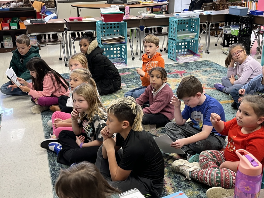 Students listen to a lesson on the different ways the letter Y can sound in a word.