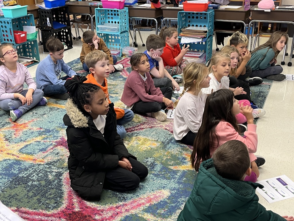 Students listen to a lesson on the different ways the letter Y can sound in a word.