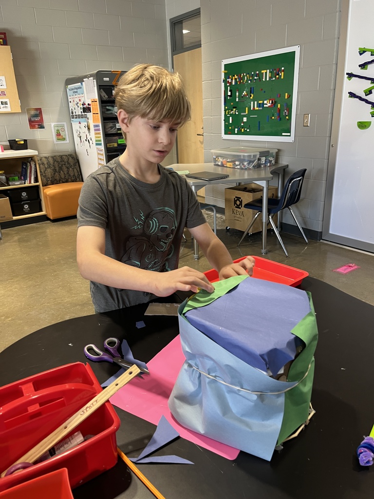 A student engineers a model of a musical instrument in the innovation lab.