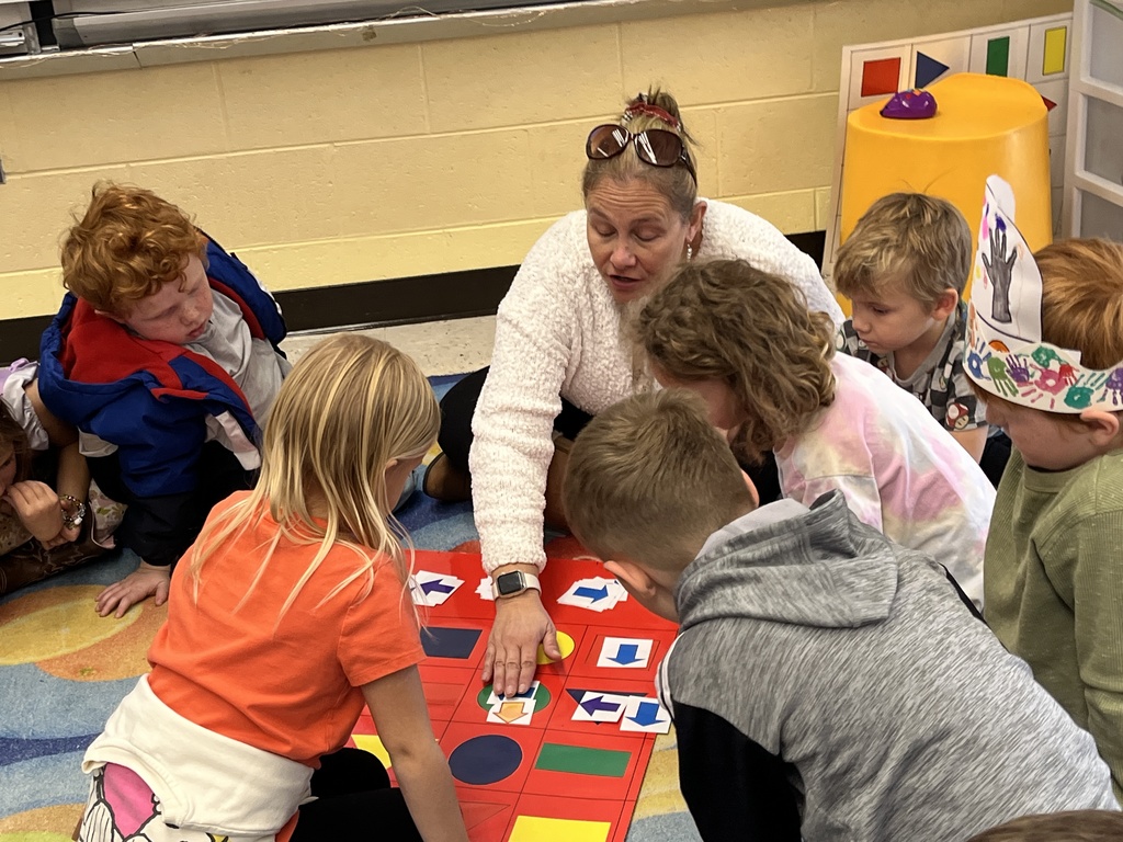 Students in technology class learn the basics of coding and building an algorithm from their teacher.