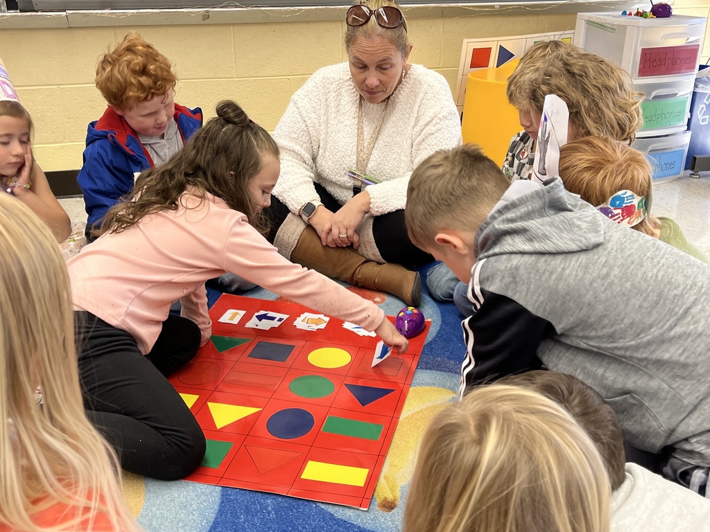 Students in technology class learn the basics of coding and building an algorithm from their teacher.