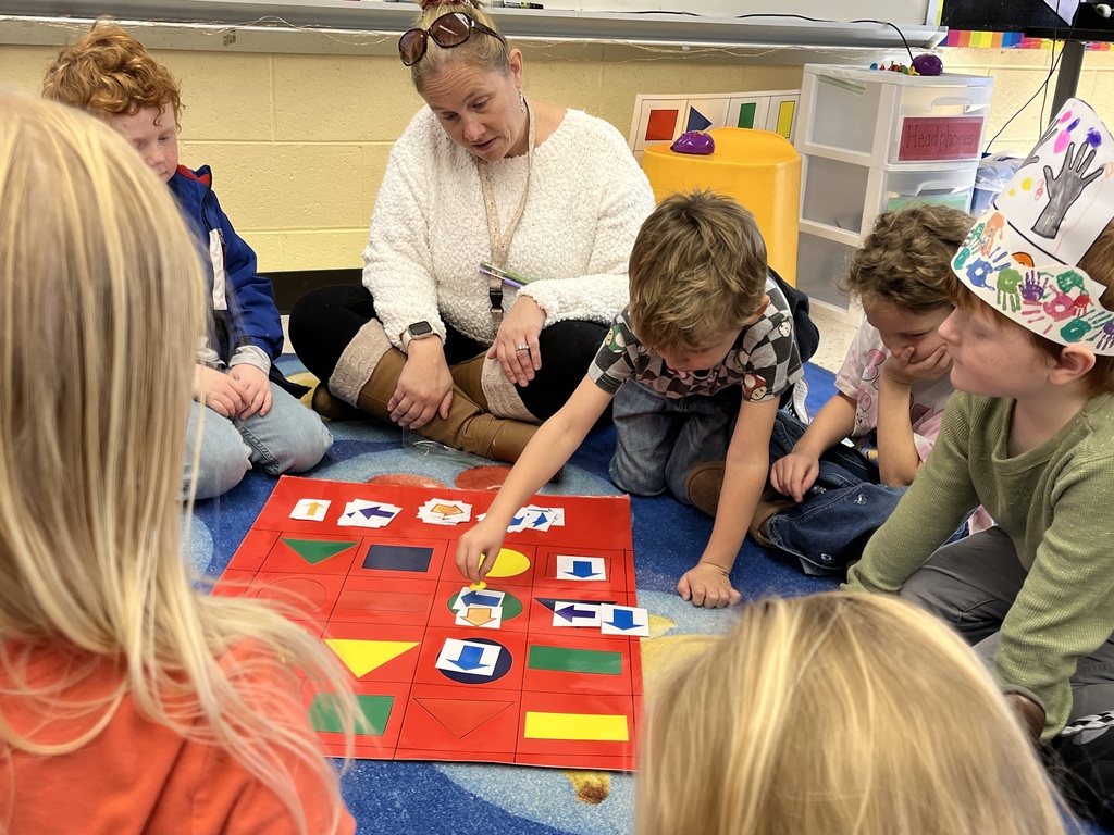 Students in technology class learn the basics of coding and building an algorithm from their teacher.