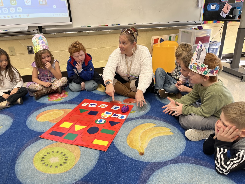 Students in technology class learn the basics of coding and building an algorithm from their teacher.