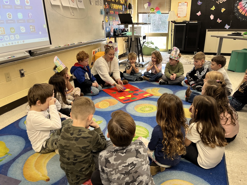Students in technology class learn the basics of coding and building an algorithm from their teacher.