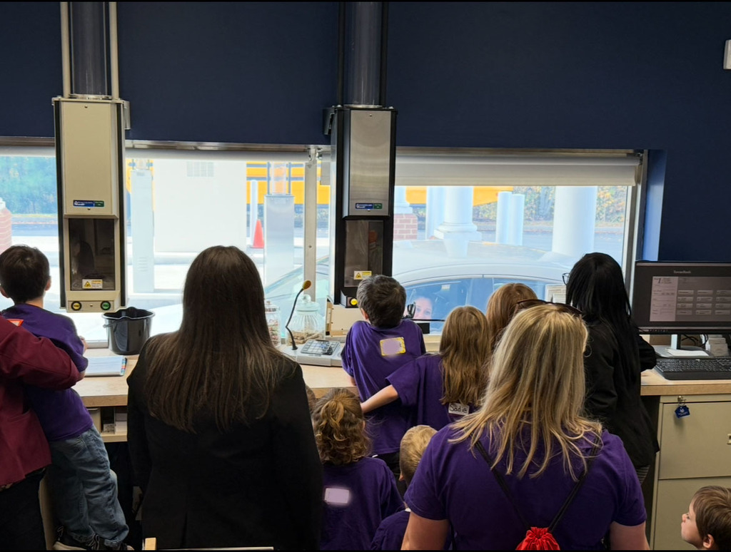 A kindergarten class gets a lesson at a bank.
