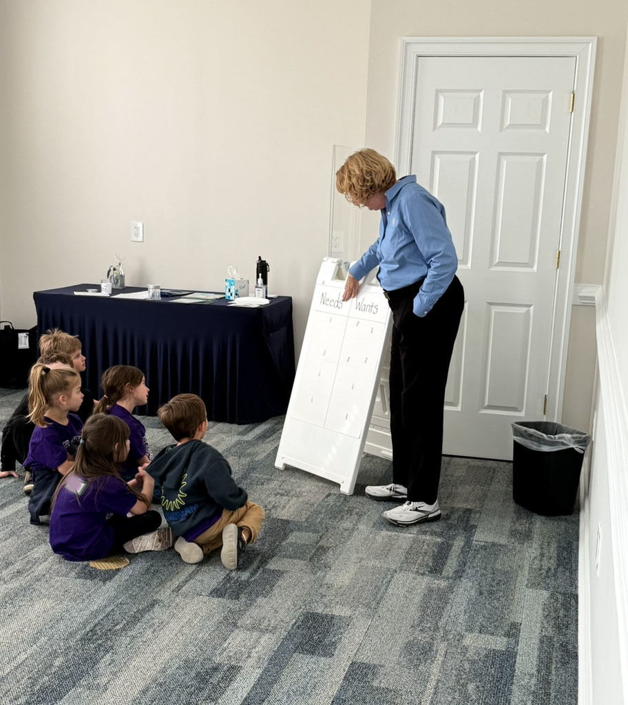 A kindergarten class gets a lesson at a bank.