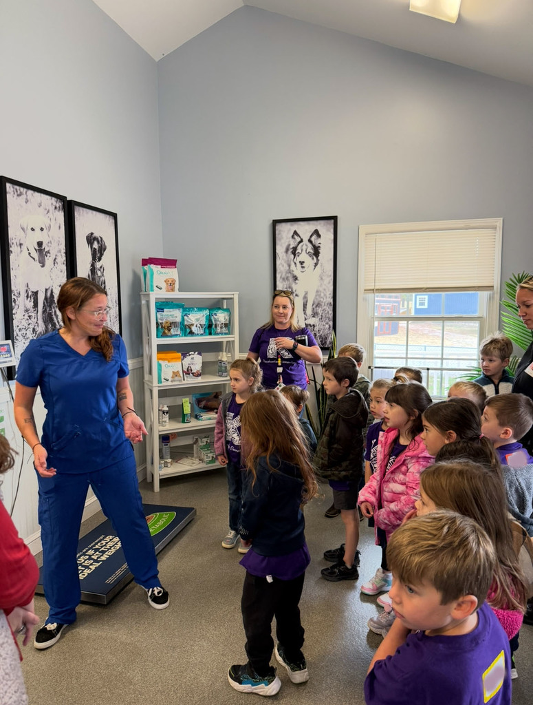 A kindergarten class  takes a tour of a veterinary clinic.
