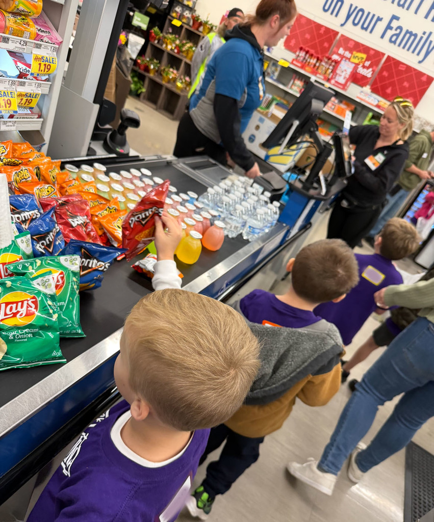 A kindergarten class takes a tour of a grocery store.