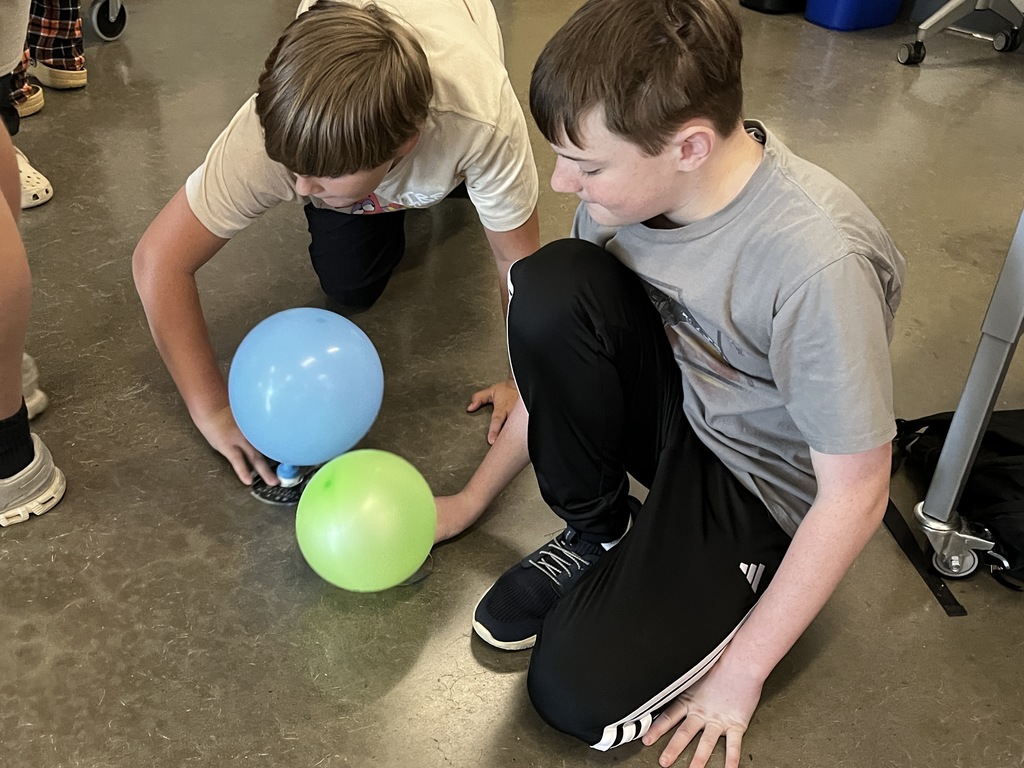 Students conduct experiments related to Newton's Laws of Motion.